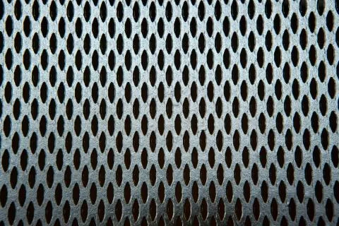 The texture and pattern of perforated metal. Stock Photos