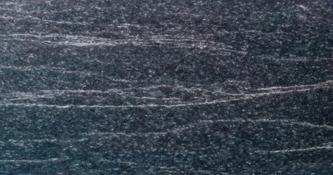 Texture and Seamless background of black granite stone. Stock Photos