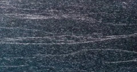 Texture and Seamless background of black granite stone. Black white gray g... Stock Photos