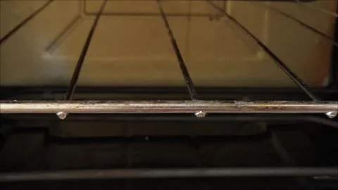 The texture and structure of fat and dirt on a long-unwashed stove and oven Stock Footage 313186459