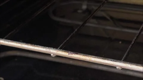 The texture and structure of fat and dirt on a long-unwashed stove and oven Stockbeeldmateriaal 313186517