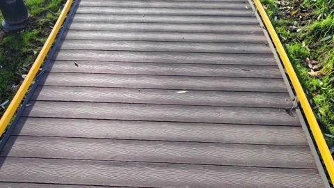 The texture of artificial gray wooden coating for walks and trips on a scooter Stock Footage 164839767