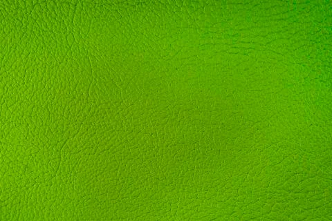 Texture of artificial leather. Green background or backdrop of leatherette. Stock Photos