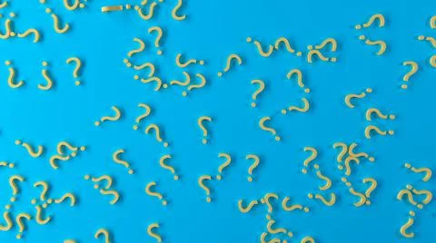 Texture of a asymmetrically lined question marks on a light blue background Foto stock