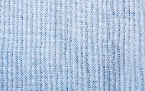 Texture backdrop photo of blue colored cotton cloth. Stock Photos