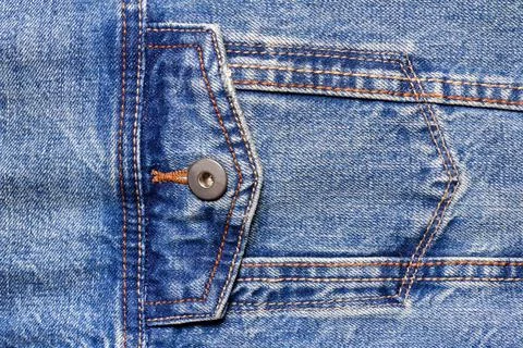 Texture backdrop photo of blue colored denim cloth. Stock Photos