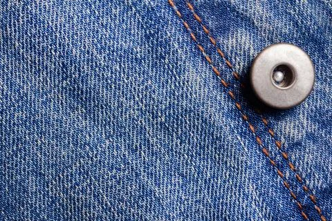 Texture backdrop photo of blue colored denim cloth. Stock Photos
