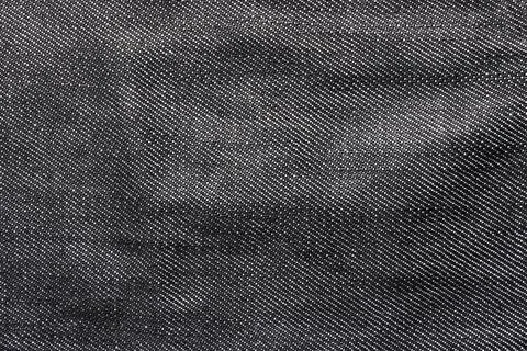 Texture backdrop photo of grey colored denim cloth. Stock Photos