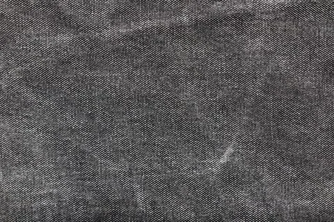 Texture backdrop photo of grey colored worn denim cloth. 스톡 사진