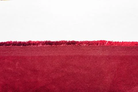 Texture backdrop photo of red colored cotton cloth edge. Stock Photos