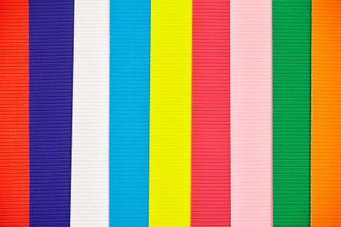 Texture backdrop with several different colored strips of corrugated cardboar 库存照片