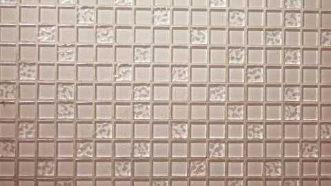Texture background beige mosaic, small square transparent tiles on the wall 写真素材