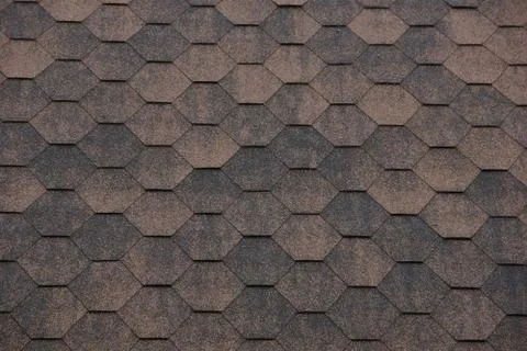 Texture background bituminous shingles hexagonal honeycomb shape brown. Stock Photos