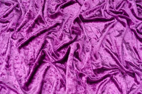 Texture, background of folded purple satin fabric Stock Photos