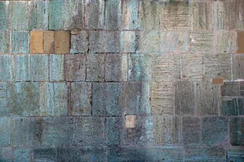 Texture, background of the fortress wall lined with bright jagged stones of Фото