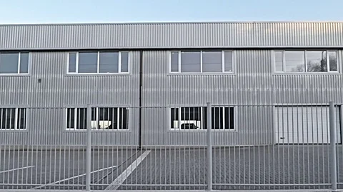 Texture, background, frame from an industrial building with a metal fence Stock Footage 112631196