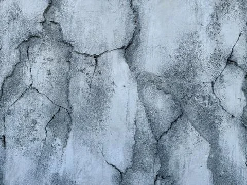 Texture background gray concrete wall with very strong cracks Stock Photos