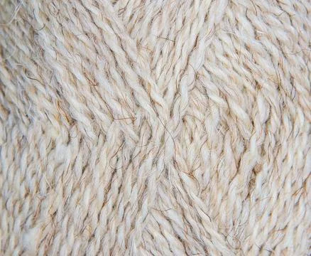 Texture background. Knitted pattern with metallic thread Stock Photos