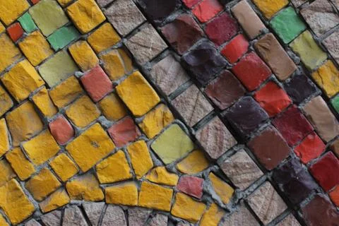 Texture background of mosaic multi colored stones on the wall. Colorful texture  Stock Photos