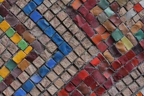 Texture background of mosaic multi colored stones on the wall. Colorful texture  Stock Photos