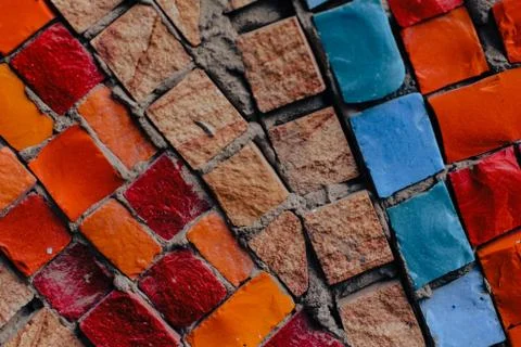 Texture background of mosaic multi colored stones on the wall. Colorful texture  Stock Photos