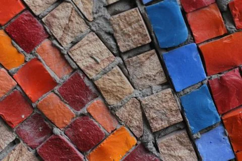Texture background of mosaic multi colored stones on the wall. Colorful texture  Stock Photos