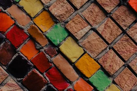 Texture background of mosaic multi colored stones on the wall. Colorful texture  Stock Photos