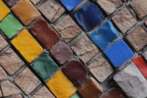 Texture background of mosaic multi colored stones on the wall. Colorful texture  Stock Photos