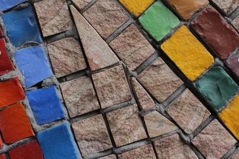 Texture background of mosaic multi colored stones on the wall. Colorful texture  Stock Photos