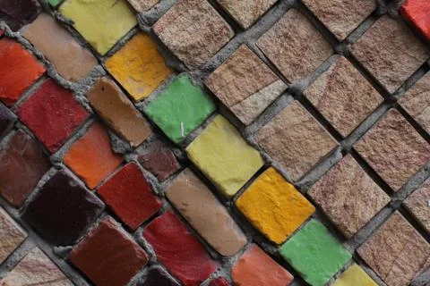 Texture background of mosaic multi colored stones on the wall. Colorful texture  Stock Photos