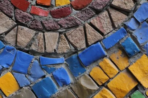 Texture background of mosaic multi colored stones on the wall. Colorful texture  Stock Photos