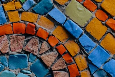 Texture background of mosaic multi colored stones on the wall. Colorful texture  Stock Photos