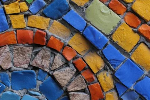 Texture background of mosaic multi colored stones on the wall. Colorful texture  Stock Photos