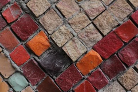 Texture background of mosaic multi colored stones on the wall. Colorful texture  Stock Photos