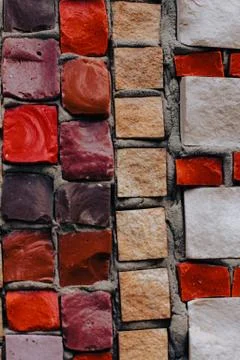Texture background of mosaic multi colored stones on the wall. Colorful texture  Stock Photos