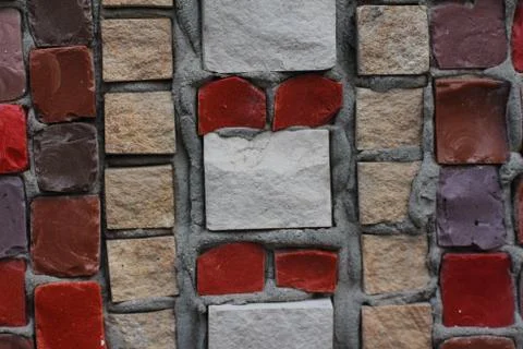 Texture background of mosaic multi colored stones on the wall. Colorful texture  Stock Photos