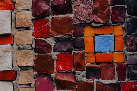 Texture background of mosaic multi colored stones on the wall. Colorful texture  Stock Photos