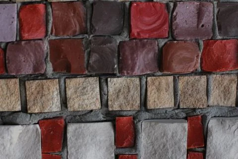 Texture background of mosaic multi colored stones on the wall. Colorful texture  Stock Photos