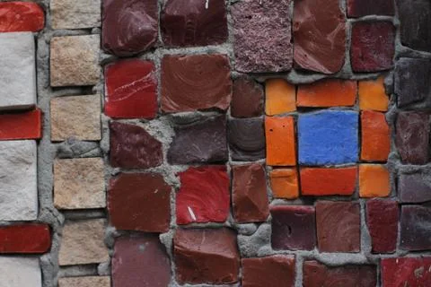 Texture background of mosaic multi colored stones on the wall. Colorful texture  Stock Photos