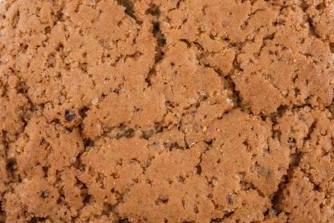 Texture background of oat cookie with sugar and raisins. Stock Photos