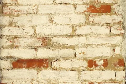 Texture background of old bricks wall with peeling paint. Stock Photos