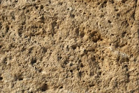 Texture background of old natural stone brick wall in yellow with joint and r Foto stock