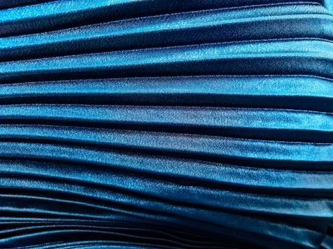 Texture, background, pattern, Cloth pleated blue. A shiny finished folded sat Stock Photos