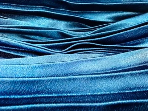 Texture, background, pattern, Cloth pleated blue. A shiny finished folded sat Stock Photos
