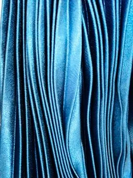 Texture, background, pattern, Cloth pleated blue. A shiny finished folded sat Stock Photos