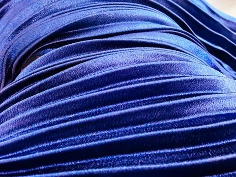 Texture, background, pattern, Cloth pleated blue. A shiny finished folded sat Stock Photos
