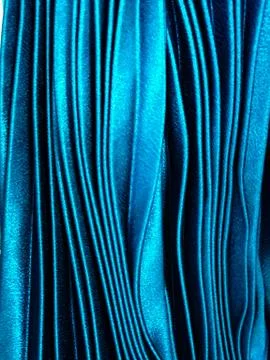 Texture, background, pattern, Cloth pleated blue. A shiny finished folded sat Stock Photos