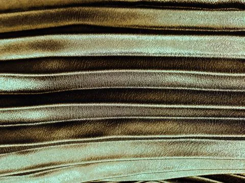 Texture, background, pattern, Cloth pleated brown. A shiny finished folded sa Stock Photos