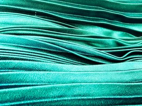Texture, background, pattern, Cloth pleated blue. A shiny finished folded sat Stock Photos