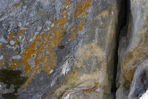 Texture, background, pattern. Gray, colorful rock, stone with a crack. Stock Photos